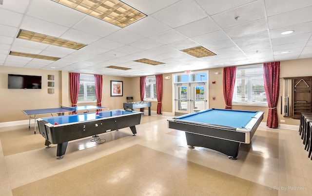 rec room with baseboards, a paneled ceiling, pool table, and french doors