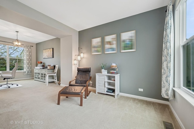 living area featuring carpet floors, baseboards, and visible vents