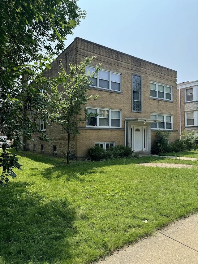 4819 Conrad St, Skokie, IL 60077 - view of property with brick siding and a front yard