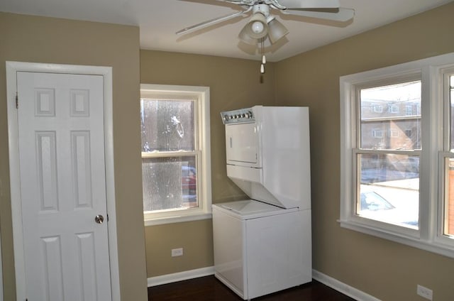 4819 Conrad St, Skokie, IL 60077 - clothes washing area with baseboards, stacked washer / drying machine, a wealth of natural light, and laundry area