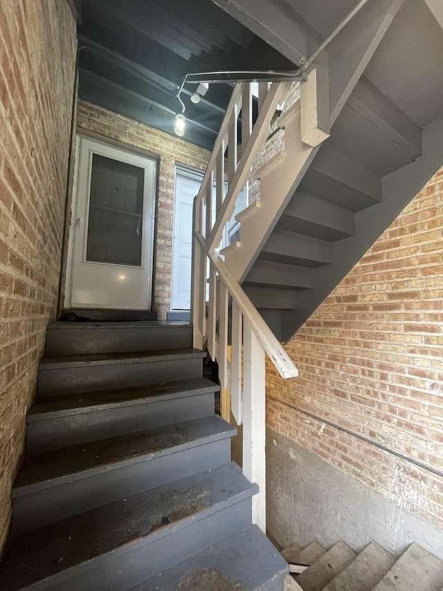 4819 Conrad St, Skokie, IL 60077 - stairway featuring brick wall