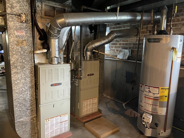 4819 Conrad St, Skokie, IL 60077 - utility room featuring visible vents and water heater
