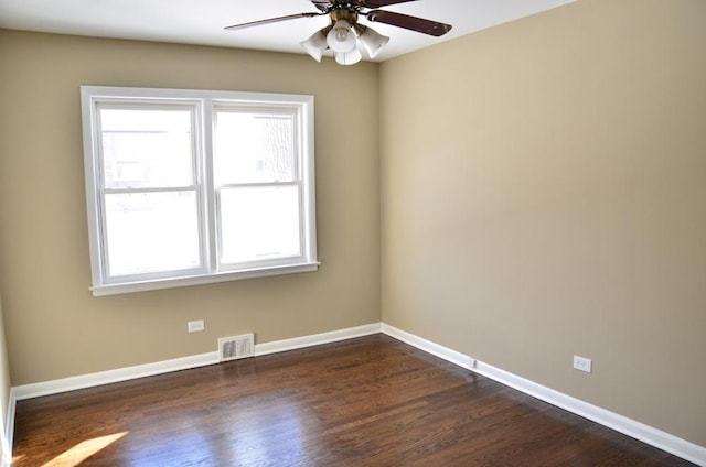4819 Conrad St, Skokie, IL 60077 - spare room with a ceiling fan, baseboards, visible vents, and dark wood finished floors