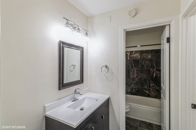 bathroom featuring toilet, shower / bathing tub combination, and vanity
