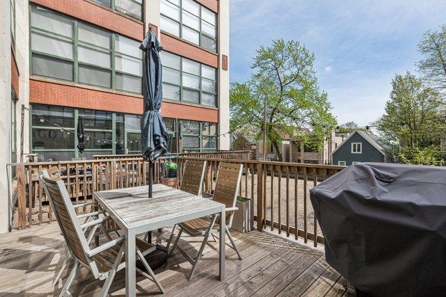 deck featuring grilling area and outdoor dining space