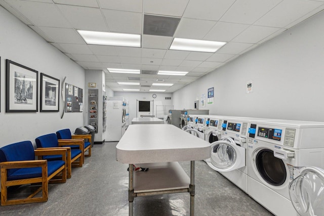 community laundry room featuring washing machine and dryer