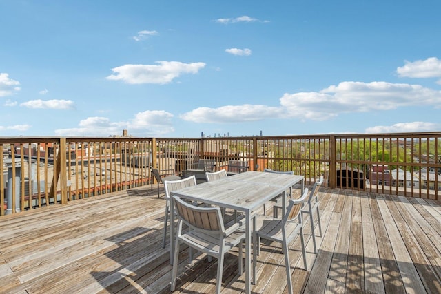 wooden deck with outdoor dining space