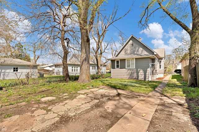 back of property with fence