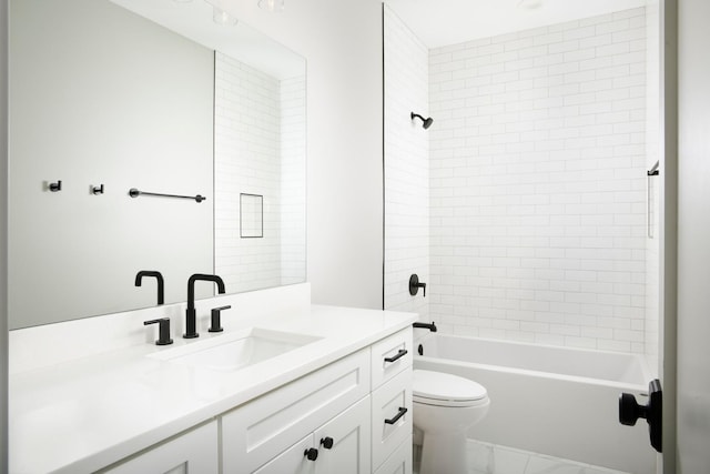 bathroom with shower / bathing tub combination, marble finish floor, toilet, and vanity