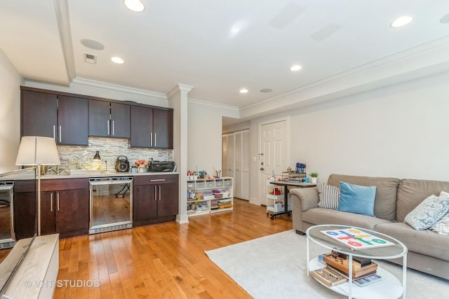 1754 W Wellington Ave Unit 1W, Chicago, IL 60657 - living area featuring wine cooler, crown molding, light wood finished floors, and recessed lighting