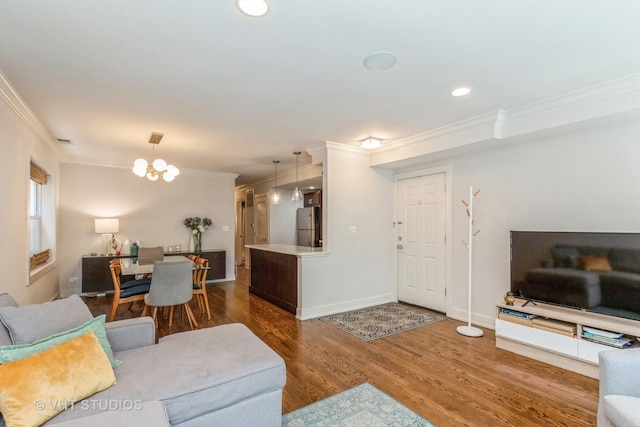 1754 W Wellington Ave Unit 1W, Chicago, IL 60657 - living room with ornamental molding, wood finished floors, recessed lighting, a chandelier, and baseboards