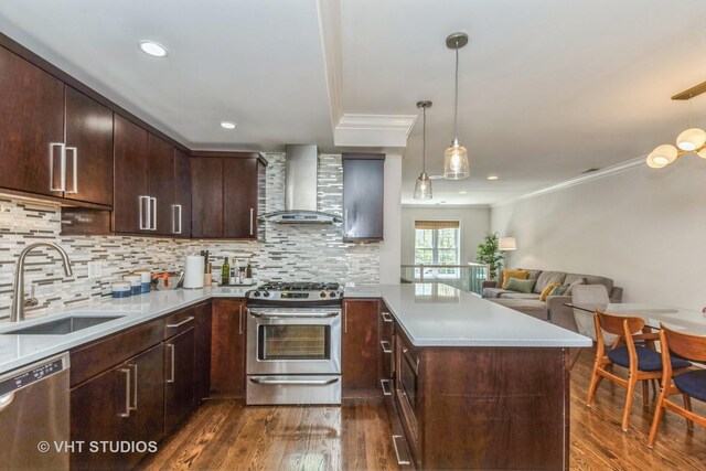 1754 W Wellington Ave Unit 1W, Chicago, IL 60657 - kitchen with wall chimney range hood, stainless steel appliances, a sink, crown molding, and dark wood-style floors