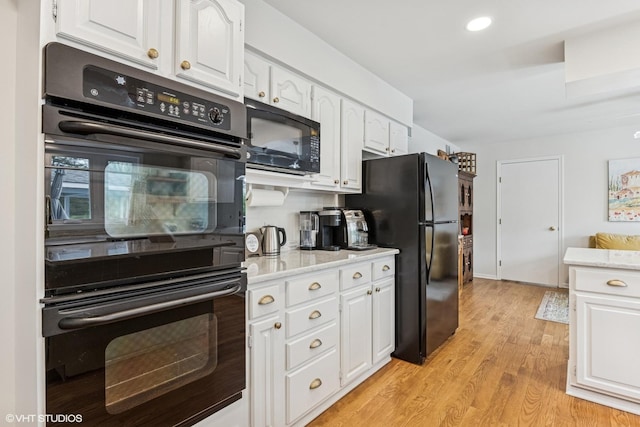 28139 W Okelly Dr, Ingleside, IL 60041 - kitchen featuring black appliances, light wood finished floors, and white cabinetry