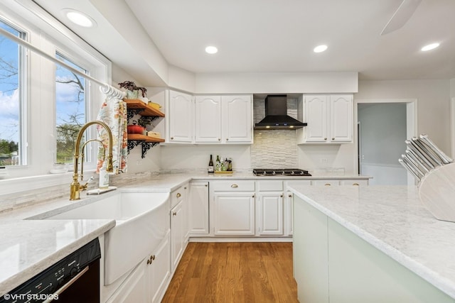 28139 W Okelly Dr, Ingleside, IL 60041 - kitchen featuring wall chimney range hood, light stone countertops, black dishwasher, a wealth of natural light, and stainless steel gas stovetop