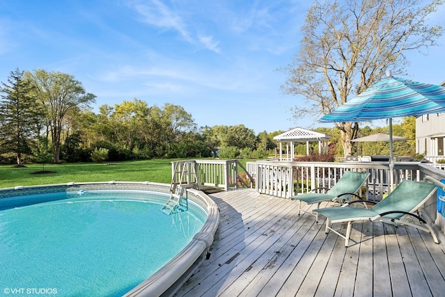 28139 W Okelly Dr, Ingleside, IL 60041 - view of pool featuring a gazebo, a lawn, and a wooden deck