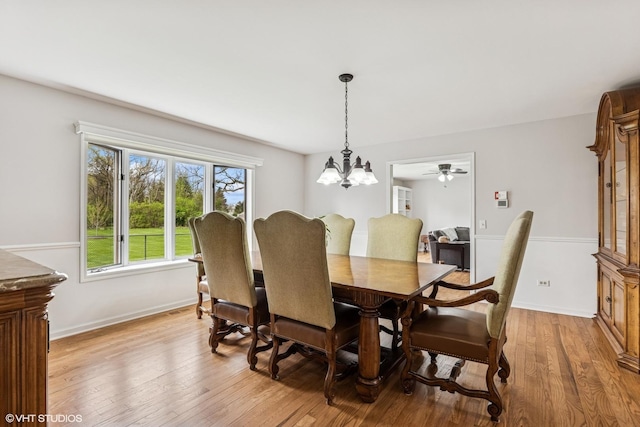 28139 W Okelly Dr, Ingleside, IL 60041 - dining room featuring an inviting chandelier, baseboards, and light wood-style flooring