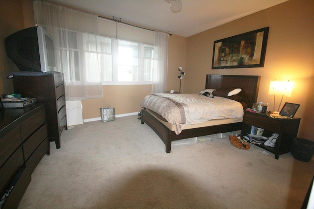 bedroom with carpet flooring and baseboards