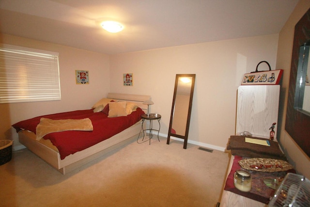 bedroom featuring carpet floors, baseboards, and visible vents