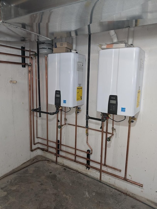 utility room featuring tankless water heater