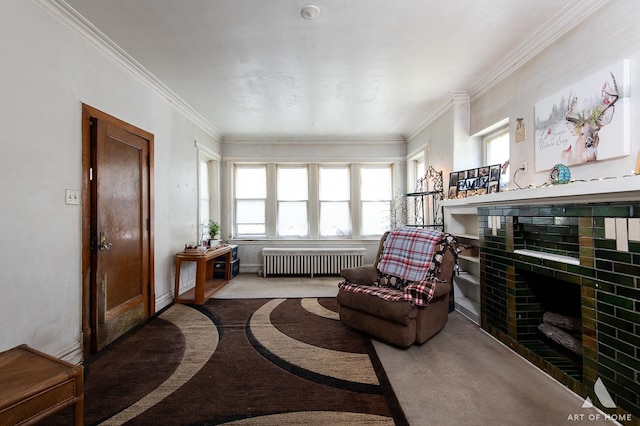 sitting room with a tile fireplace, ornamental molding, carpet flooring, and radiator