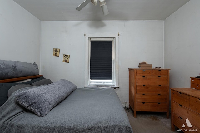 bedroom with a ceiling fan and carpet flooring