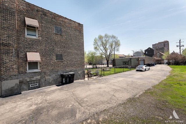 view of side of property featuring brick siding