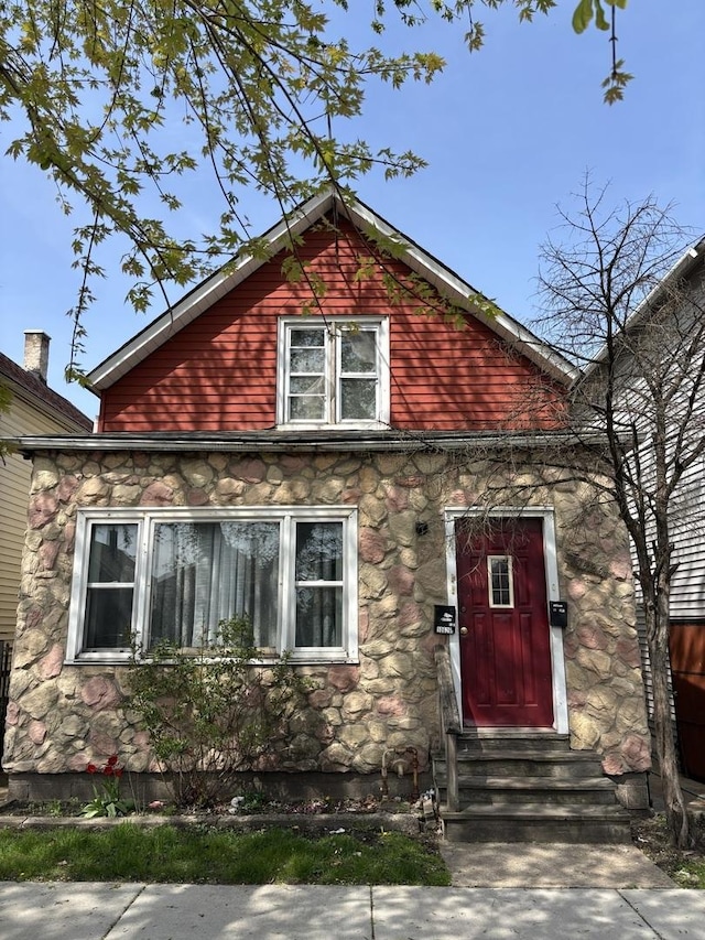 view of front of house featuring stone siding and entry steps