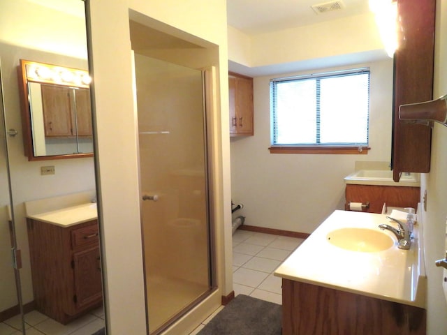 1321 Dresden Dr Unit C, Morris, IL 60450 - bathroom featuring visible vents, a stall shower, vanity, tile patterned floors, and baseboards