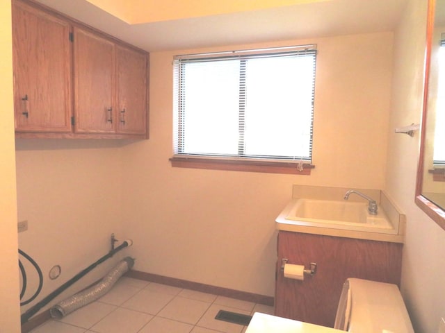 1321 Dresden Dr Unit C, Morris, IL 60450 - bathroom with baseboards, a sink, and tile patterned flooring