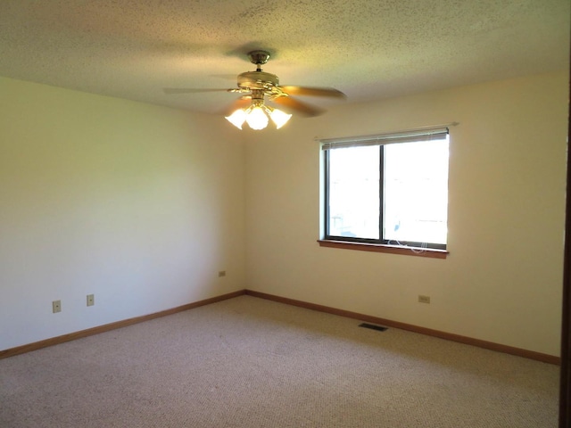 1321 Dresden Dr Unit C, Morris, IL 60450 - empty room with light colored carpet, a ceiling fan, a textured ceiling, and visible vents