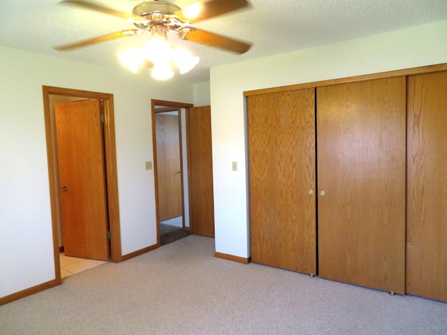 1321 Dresden Dr Unit C, Morris, IL 60450 - unfurnished bedroom with a ceiling fan, baseboards, light carpet, and a closet