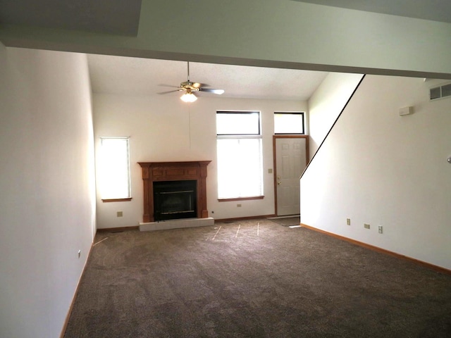 1321 Dresden Dr Unit C, Morris, IL 60450 - unfurnished living room featuring baseboards, a ceiling fan, carpet, and a glass covered fireplace