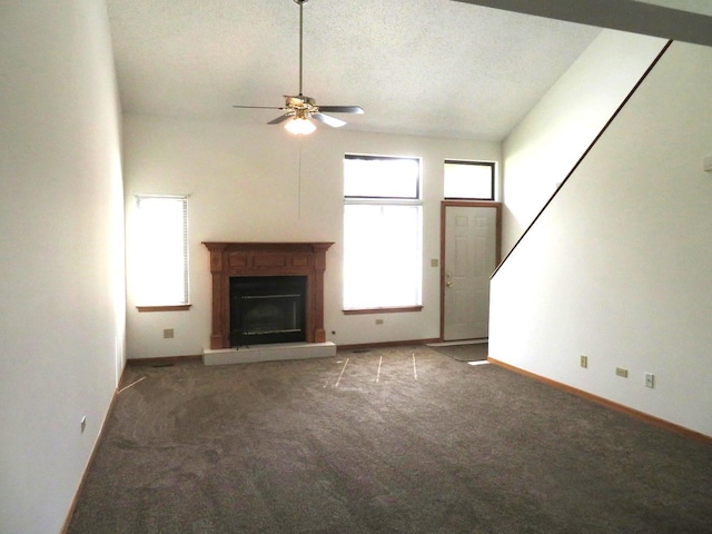 1321 Dresden Dr Unit C, Morris, IL 60450 - unfurnished living room featuring a glass covered fireplace, baseboards, ceiling fan, and carpet flooring