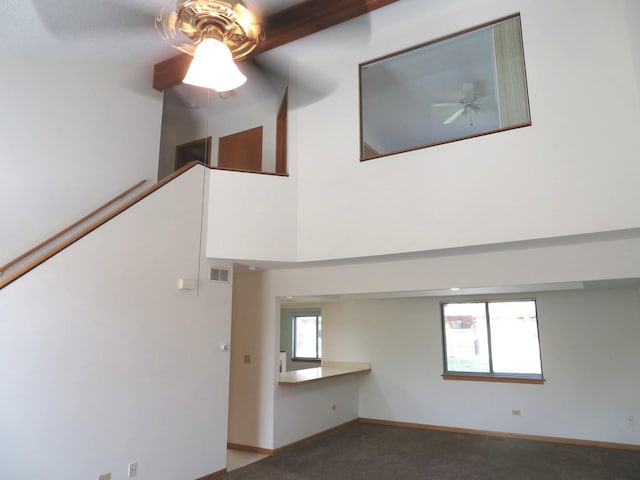 1321 Dresden Dr Unit C, Morris, IL 60450 - unfurnished living room with carpet flooring, ceiling fan, visible vents, and baseboards