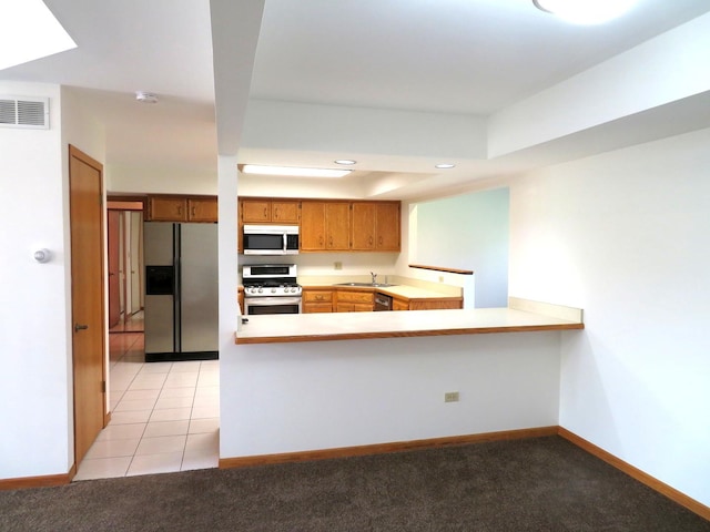 1321 Dresden Dr Unit C, Morris, IL 60450 - kitchen featuring visible vents, appliances with stainless steel finishes, brown cabinets, a sink, and light countertops