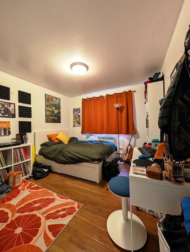 bedroom featuring wood finished floors
