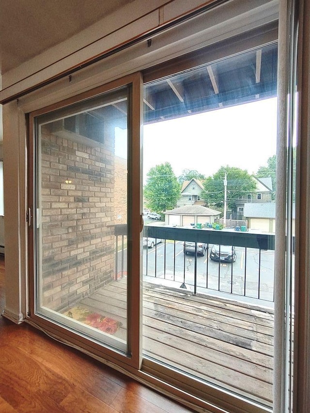 doorway to outside with wood finished floors