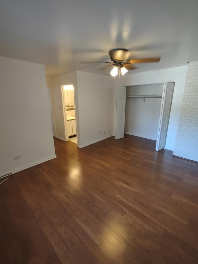 unfurnished bedroom with dark wood finished floors, ceiling fan, baseboards, and a closet