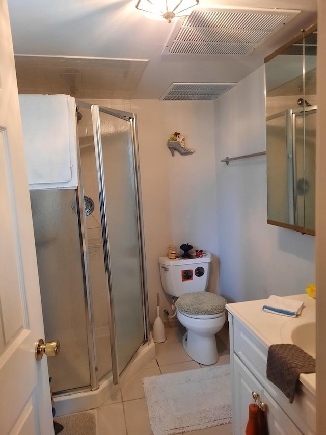 5030 N Keeler Ave, Chicago, IL 60630 - bathroom featuring visible vents, tile patterned flooring, a shower stall, vanity, and toilet