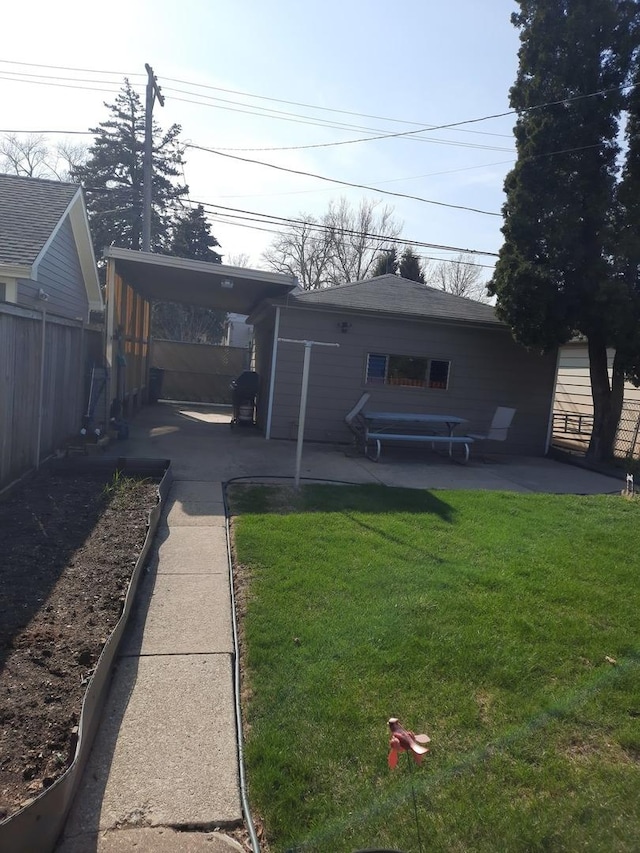 5030 N Keeler Ave, Chicago, IL 60630 - back of house featuring a lawn, fence, and a patio