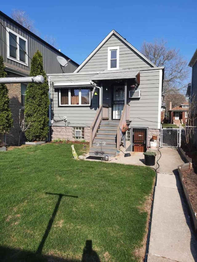 5030 N Keeler Ave, Chicago, IL 60630 - bungalow featuring fence, a gate, and a front lawn