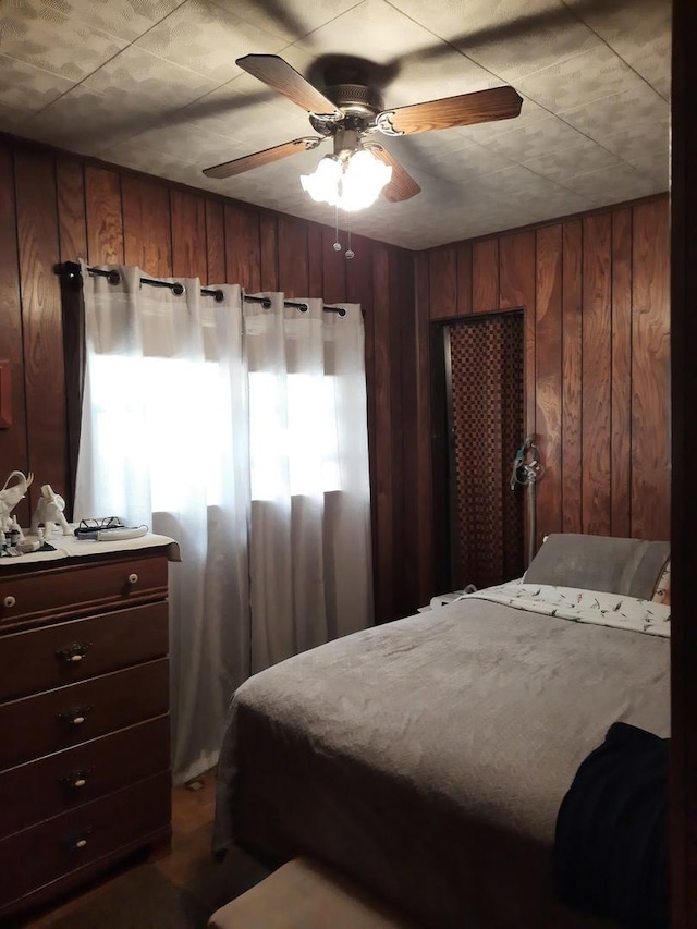 5030 N Keeler Ave, Chicago, IL 60630 - bedroom with a ceiling fan and wood walls