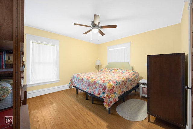 3231 Wesley Ave, Berwyn, IL 60402 - bedroom with baseboards, hardwood / wood-style flooring, and a ceiling fan
