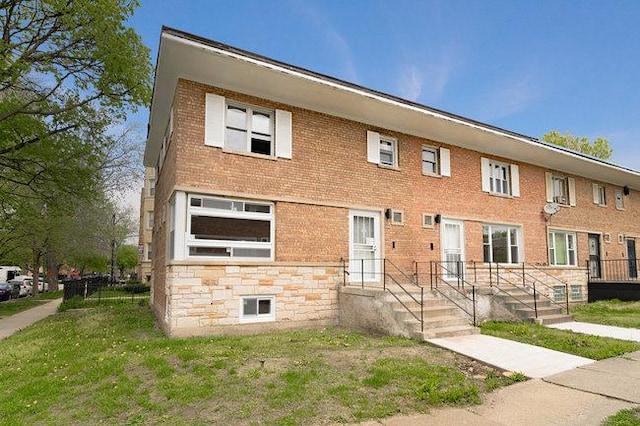 view of property featuring brick siding