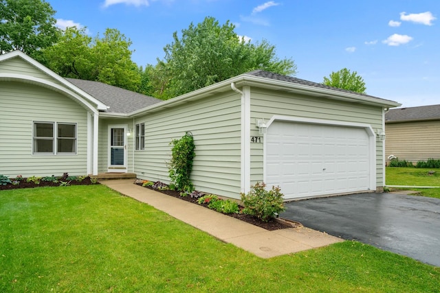 471 W Miller Ave, Hinckley, IL 60520 - ranch-style home featuring asphalt driveway, a front lawn, roof with shingles, and an attached garage