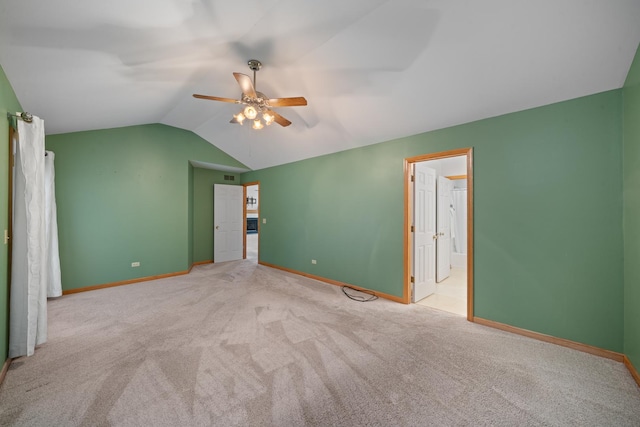 471 W Miller Ave, Hinckley, IL 60520 - unfurnished bedroom featuring lofted ceiling, carpet flooring, baseboards, ceiling fan, and connected bathroom