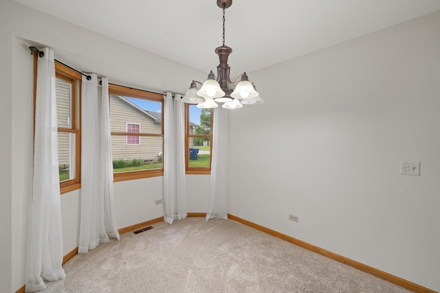 471 W Miller Ave, Hinckley, IL 60520 - unfurnished room with a chandelier, light carpet, and baseboards