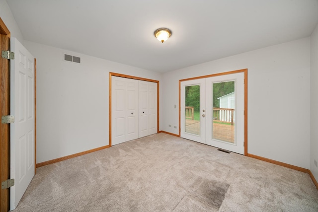 471 W Miller Ave, Hinckley, IL 60520 - unfurnished bedroom featuring access to outside, baseboards, french doors, and carpet flooring