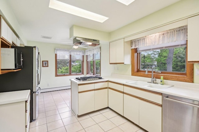 38413 N Tewes Ct, Beach Park, IL 60087 - kitchen with a sink, baseboard heating, appliances with stainless steel finishes, a peninsula, and light countertops