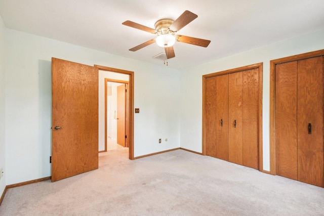 38413 N Tewes Ct, Beach Park, IL 60087 - unfurnished bedroom with carpet, multiple closets, baseboards, and a ceiling fan